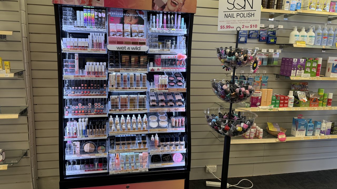 The make-up stand in the pharmacy, with nail polish and skincare on the shelves alongside